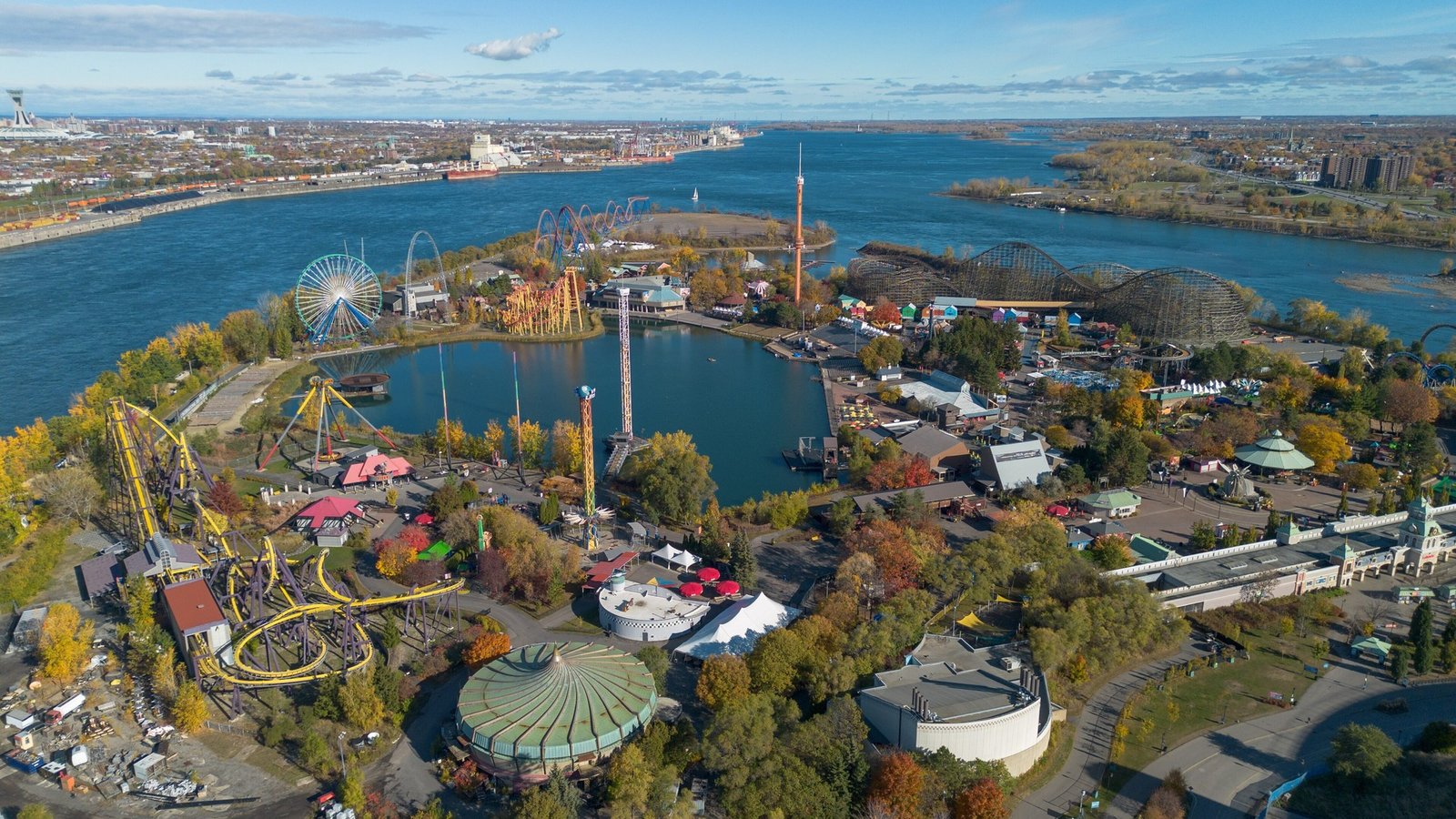 Aerial view of La Ronde amusement park on the Expo 67 islands, Montreal, with its roller coasters visible among the rides