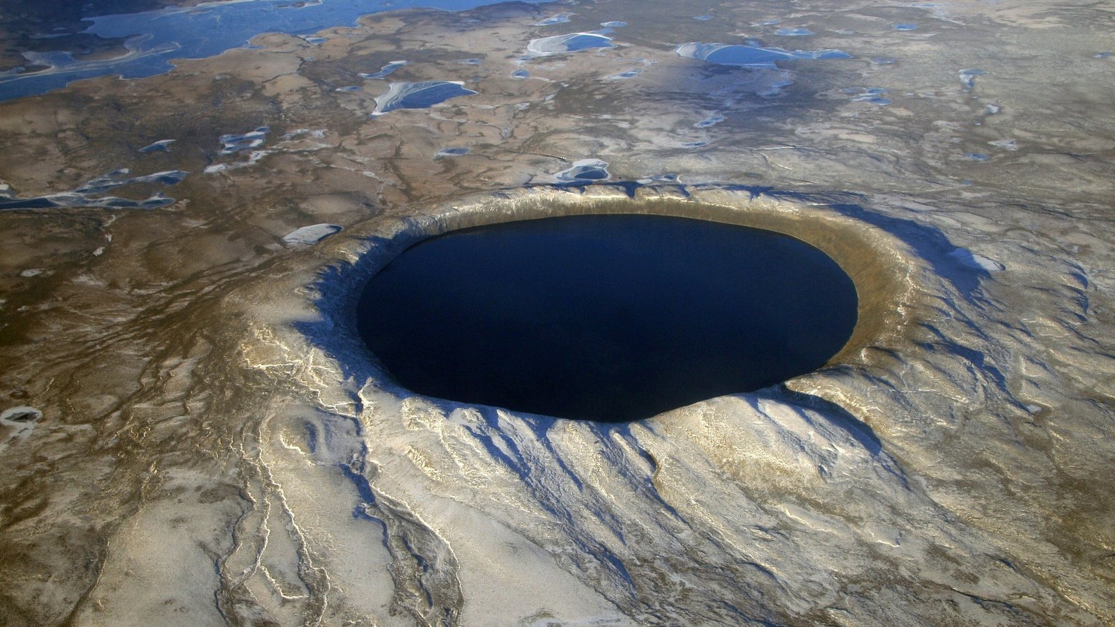 Aerial view of the near-perfectly circular Pingualuit crater lake in the Nunavik tundra