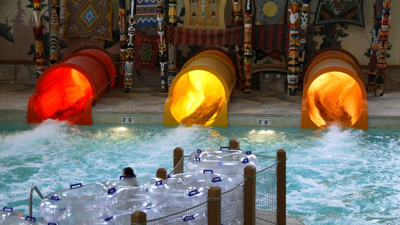 A themed indoor water park interior with slide towers at a Great Wolf Lodge resort